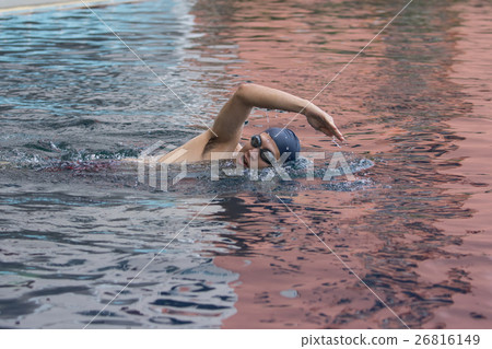 male swimming freestyle in pool during competition male swimming freestyle in pool during competition 26816149