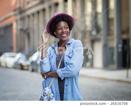 frican American woman listening to music 26816706