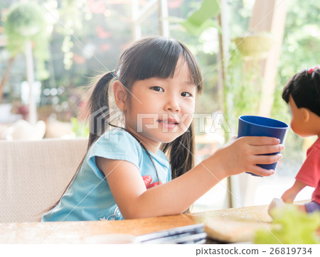 Asian girl child drink some water Asian girl child drink some water 26819734