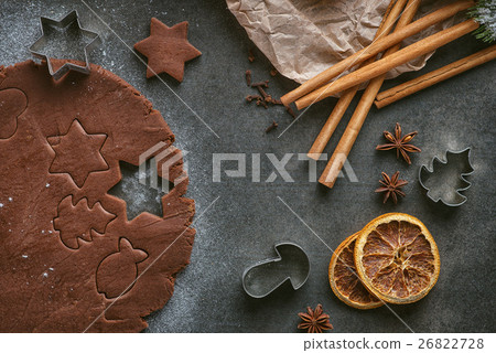 cutting gingerbread cookie with cinnamon, anise cutting gingerbread cookie with cinnamon, anise 26822728