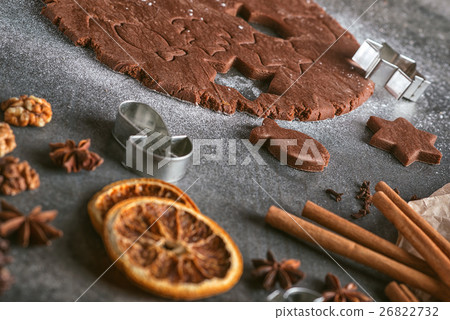 cutting gingerbread cookie with cinnamon cutting gingerbread cookie with cinnamon 26822732