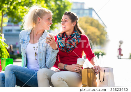 Women shopping with bags in city Women shopping with bags in city 26823480