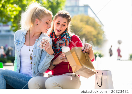 Women shopping with bags in city 26823481