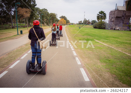Group of people traveling on Segway in the park 26824217