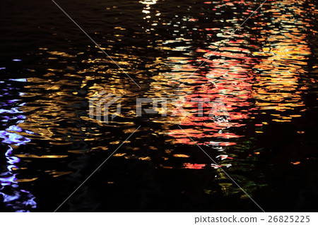 Reflection of colorful light on waterwave at night Reflection of colorful light on waterwave at night 26825225