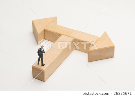 A businessman standing at a turning point A businessman standing at a turning point 26825671