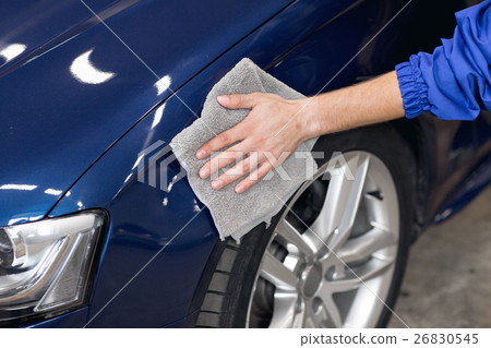 man polishing cleaning car with microfiber cloth man polishing cleaning car with microfiber cloth 26830545