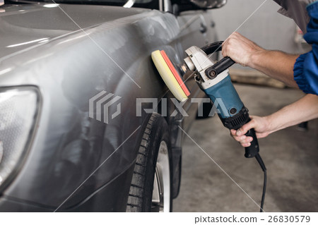 man polishing cleaning car with microfiber cloth man polishing cleaning car with microfiber cloth 26830579