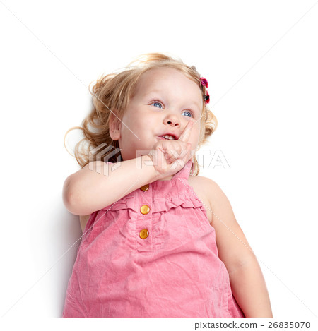 Young little girl lying over isolated white 26835070