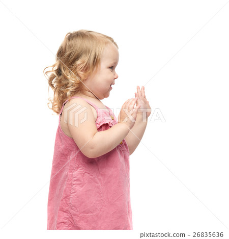 Young little girl standing over isolated white 26835636