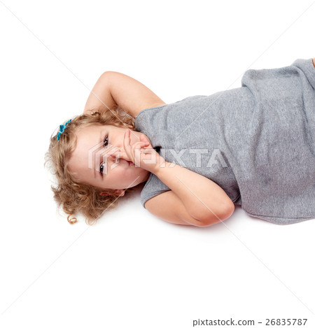 Young little girl lying over isolated white Young little girl lying over isolated white 26835787