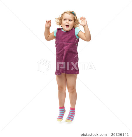 Young little girl jumping over isolated white Young little girl jumping over isolated white 26836141