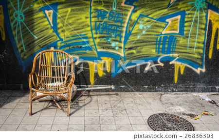Wooden old chair in a small street 26836303