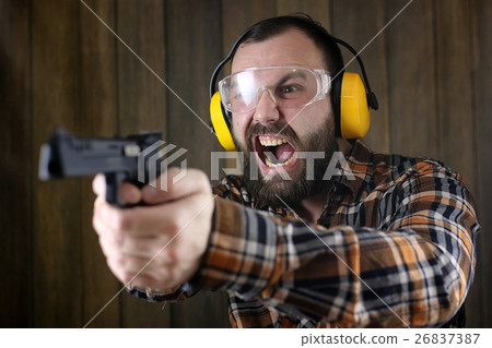 man with put on protective goggles ear training man with put on protective goggles ear training 26837387