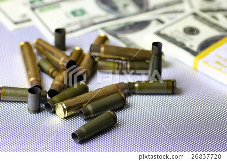 bullet and money dollar on the silver case 26837720