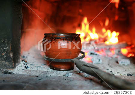 pot in the oven with food the oven fork 26837808