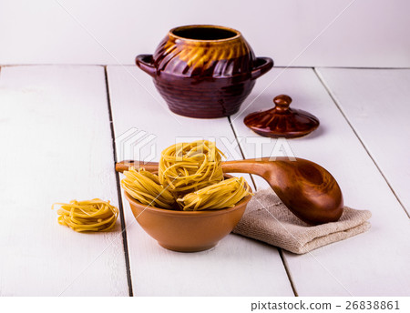 cup of spaghetti and a wooden spoon 26838861