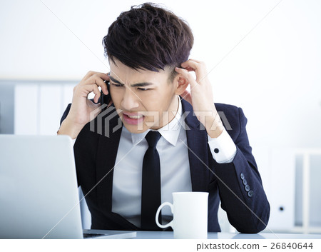 Businessman having stress in the office 26840644