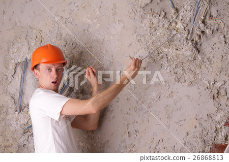 Surprised worker electric trying to fix the wires Surprised worker electric trying to fix the wires 26868813