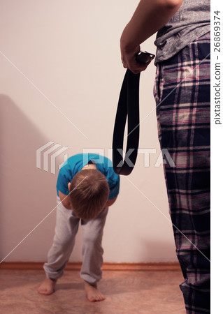 Little scared boy and angry mother with belt. 26869374