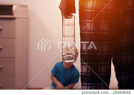 Drunk mother with bottle and scared little son 26869656