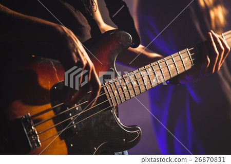 Close-up photo, bass guitar player Close-up photo, bass guitar player 26870831