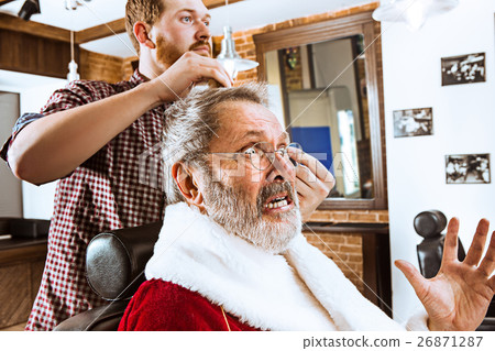 Santa claus shaving his personal barber Santa claus shaving his personal barber 26871287
