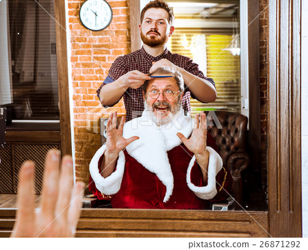 Santa claus shaving his personal barber 26871292