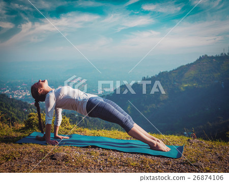 Woman doing Hatha yoga asana Purvottanasana 26874106