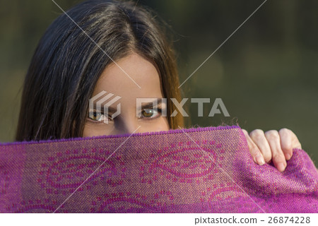 Eyes above the purple scarf. Eyes above the purple scarf. 26874228