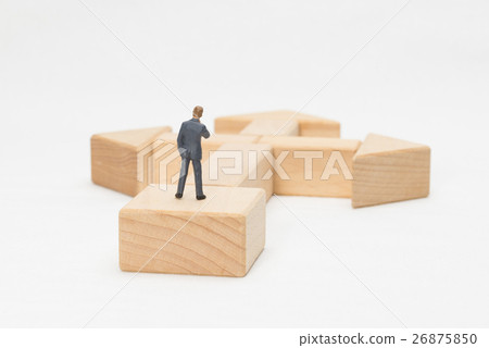 A businessman standing at a turning point A businessman standing at a turning point 26875850