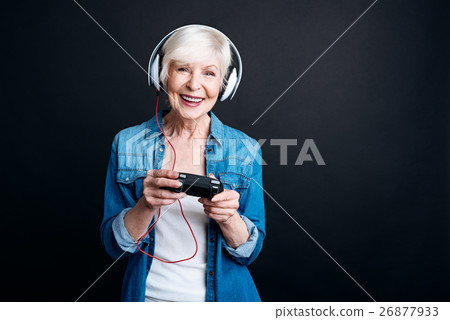 Positive aged woman playing video games 26877933