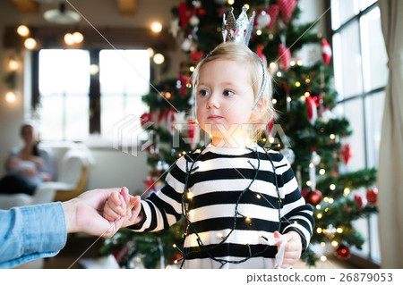 Father with daugter tangled up in light chain at 26879053