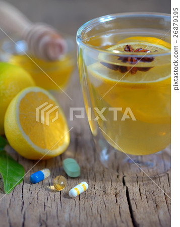 Hot lemon tea and pills 26879195