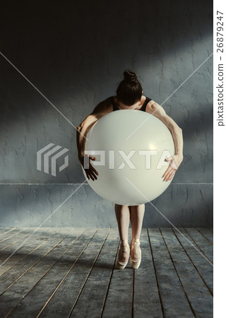 Expressive ballet dancer holding the big balloon Expressive ballet dancer holding the big balloon 26879247