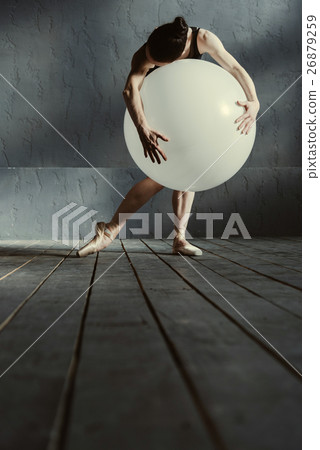 Flexible woman dancing using the white balloon Flexible woman dancing using the white balloon 26879259