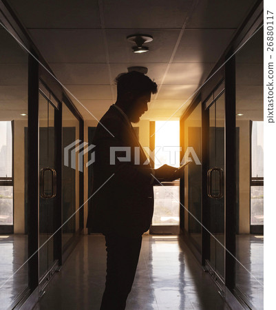 Silhouette of businessman use phone chatting alone 26880117