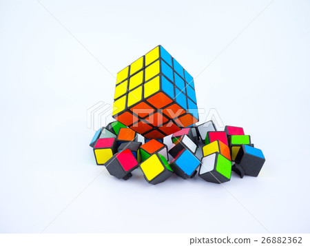 Colorful Rubik's cube and broken cube pieces Colorful Rubik's cube and broken cube pieces 26882362