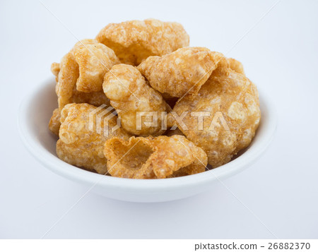 Crispy deep fried pork skin or pork rind in bowl  26882370