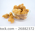 Crispy deep fried pork skin or pork rind in bowl  26882372