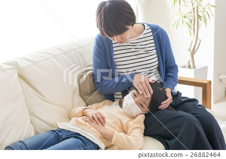 A daughter with a cold and a worried mother 26882464