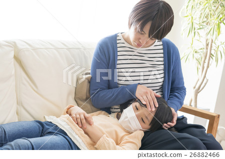 A daughter with a cold and a worried mother 26882466