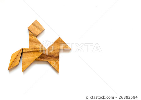 Wooden tangram as man riding horse shape 26882584
