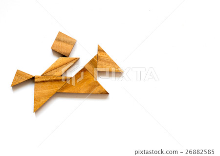 Wooden tangram as man riding horse shape 26882585