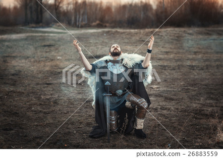 Warrior raised his hands to the sky. 26883559