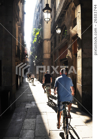 group of cyclists on a narrow street Barcelona group of cyclists on a narrow street Barcelona 26883744