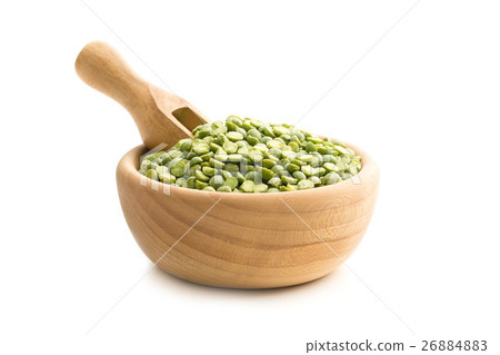 Green split peas in wooden bowl. 26884883