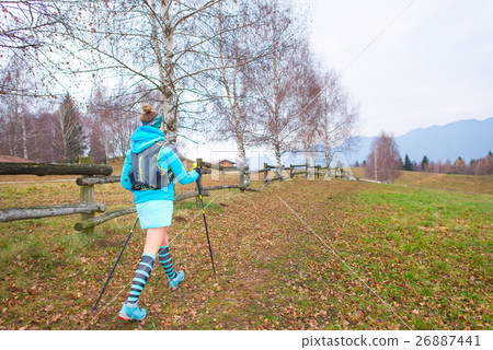 Nordic walking Girl in autumn path 26887441