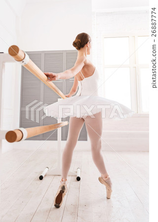 Image-side view of ballerina looking in the window 26887774