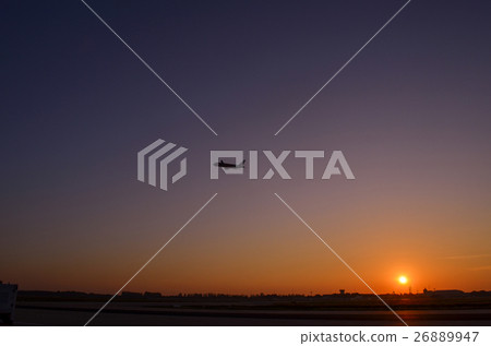 Airplane take off on sunset. Twilight sky sunset. 26889947
